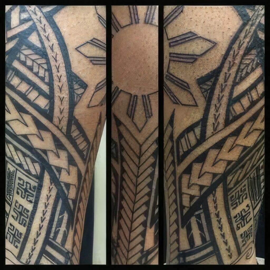 Close-up of a detailed Polynesian tribal tattoo featuring geometric patterns, intricate lines, and symbolic elements, including a sun with rays, on a person's arm.