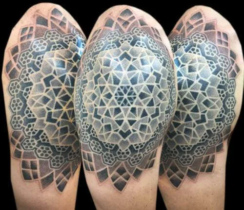 A geometric tattoo with intricate, symmetrical patterns in black and gray ink shown on a person's shoulder from three different angles.