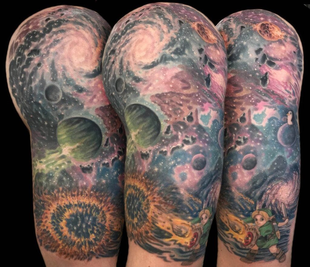 A detailed full sleeve tattoo featuring colorful cosmic elements, planets, galaxies and characters from "The Legend of Zelda" game series.