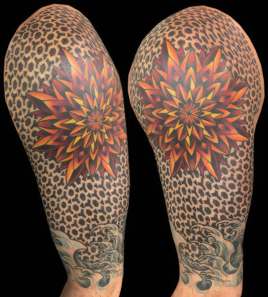 Two arms with detailed tattoos feature a red and yellow geometric flower pattern on a leopard print background, with additional cloud designs near the wrists.