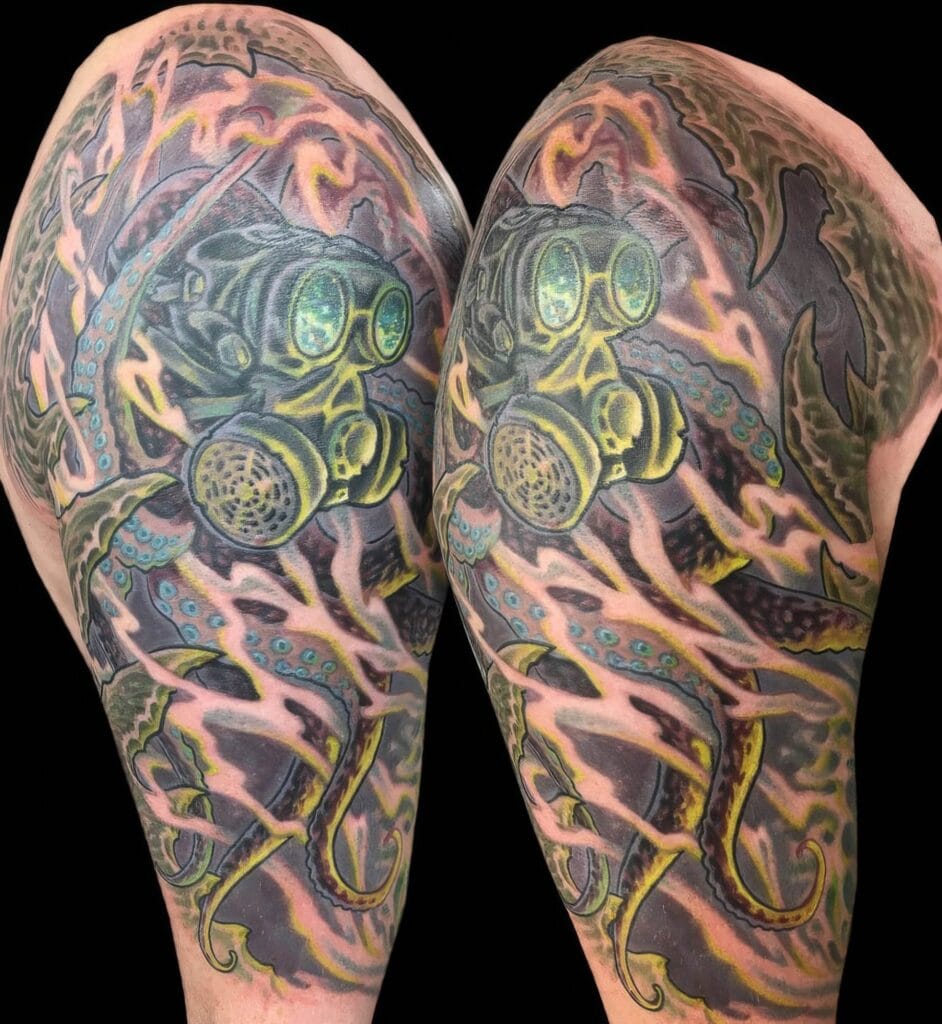Upper arm tattoo featuring a detailed design of a person in a gas mask, surrounded by vivid, abstract colors and patterns.
