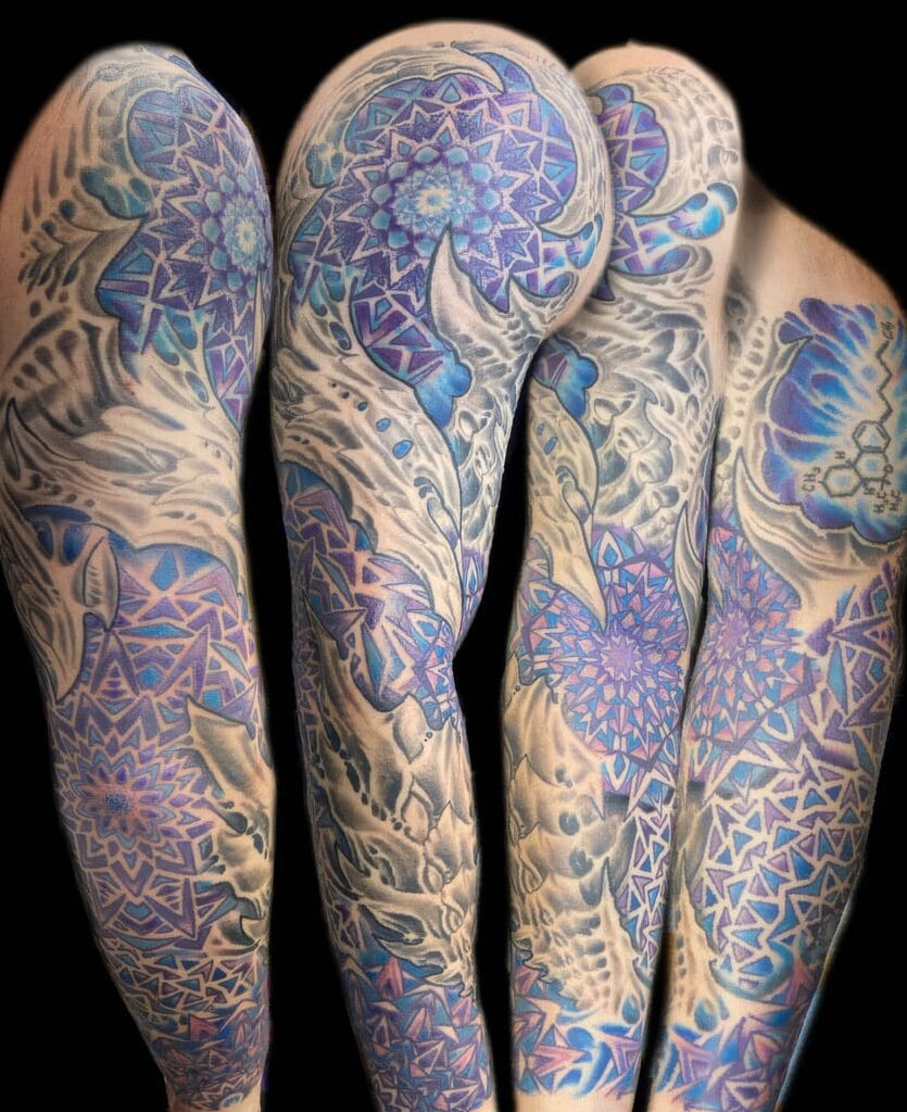A sleeve tattoo featuring an intricate design with geometric patterns, floral elements, and dominant shades of blue and purple, shown from various angles.