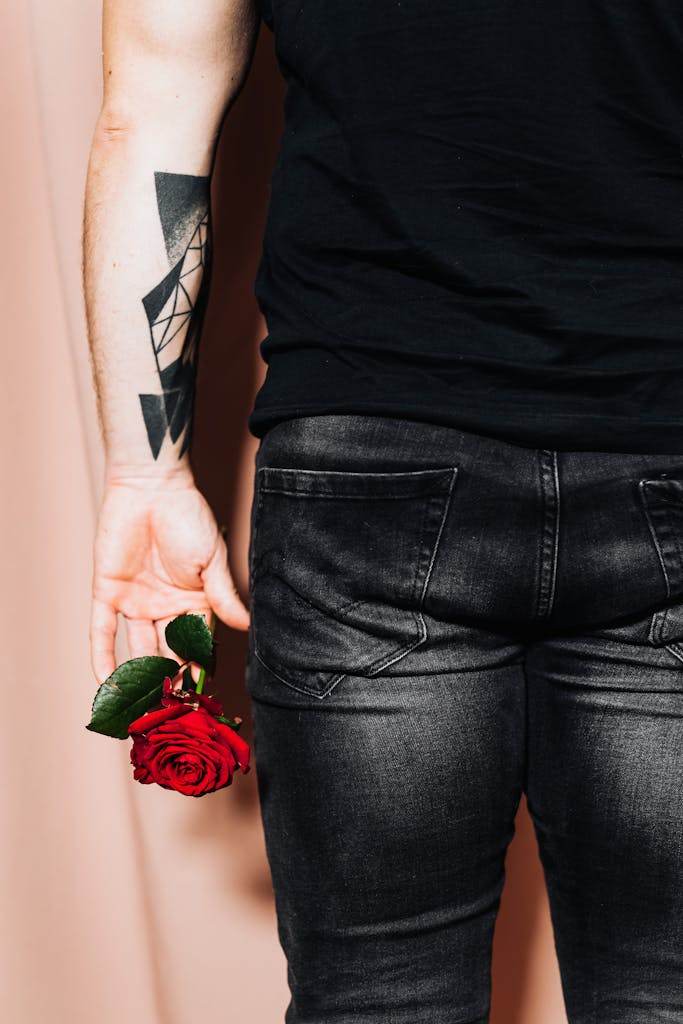 A Person Holding a Red Rose