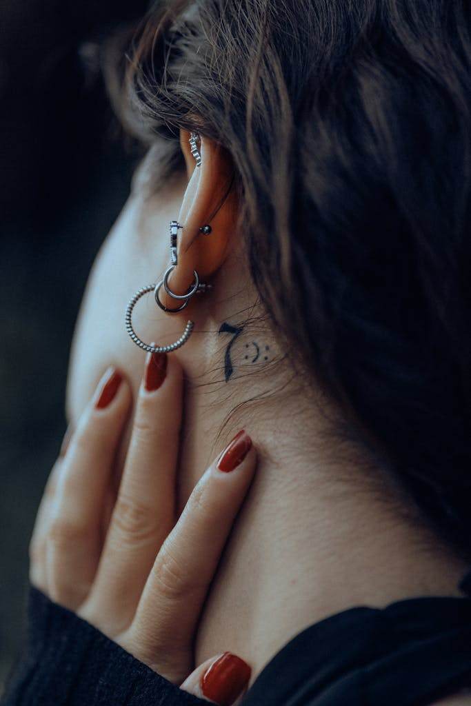 Tattoo behind Woman Ear