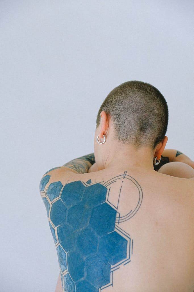 Woman With Tattoo On Her Back