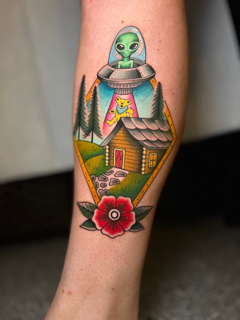 Alien in a spaceship abducting a teddy bear above a cabin with trees and a red flower at the bottom.