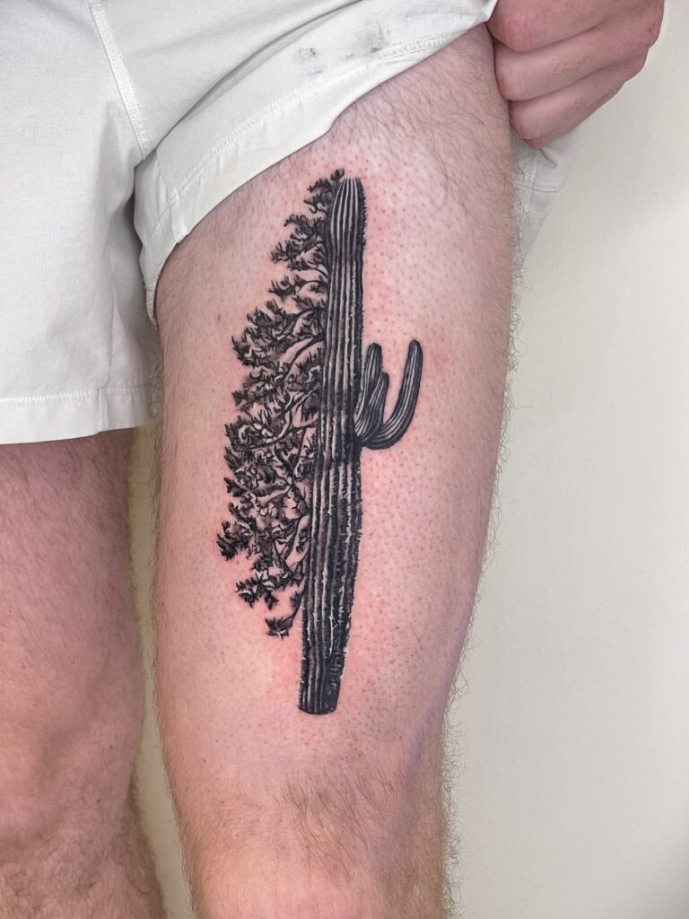 Black and gray cactus tattoo with a tree-like structure on the upper part of the thigh.
